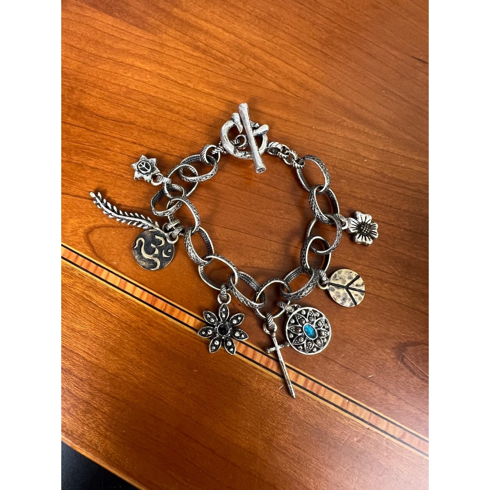 Lucky Brand Silver Tone Boho Charm Bracelet Peace Om Cross Flower Toggle 8in